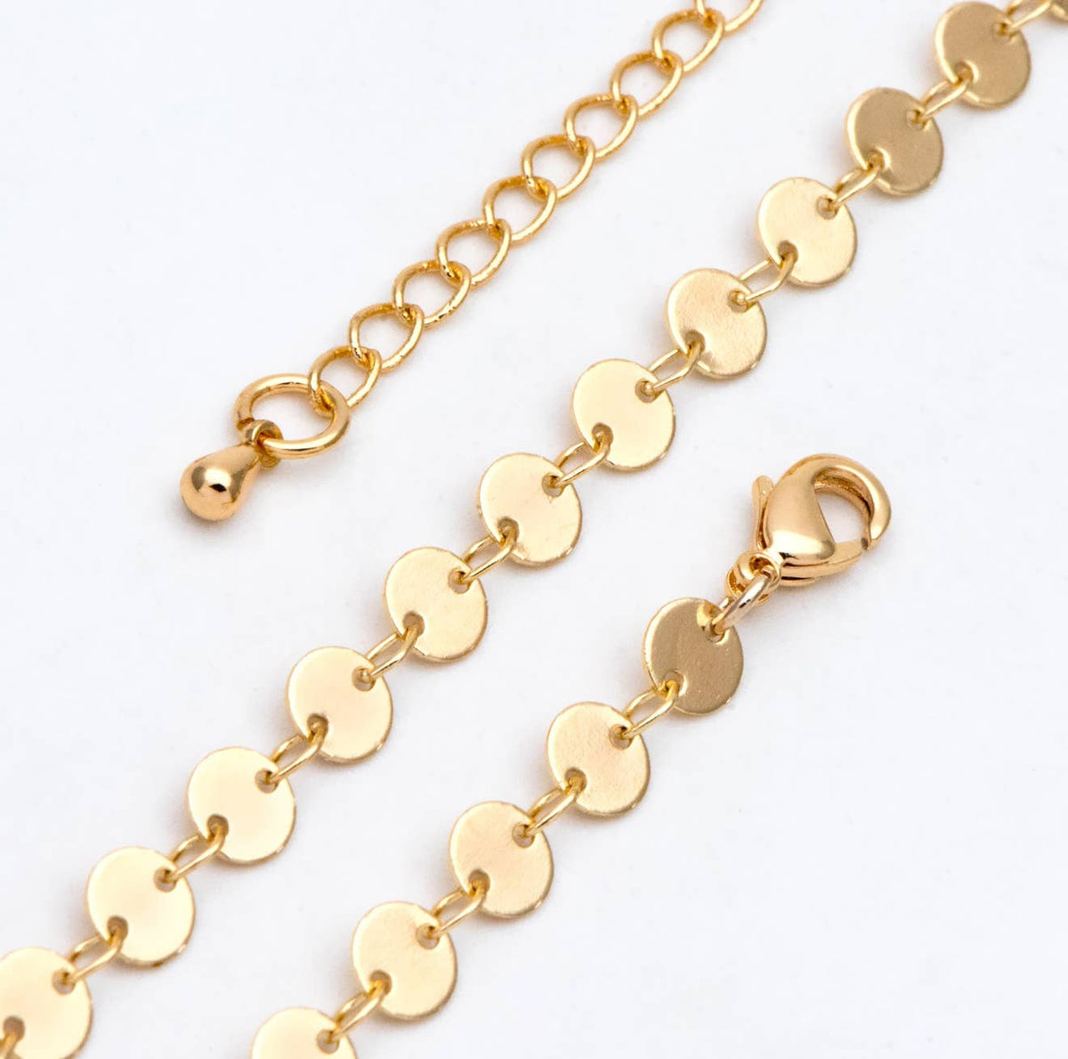 Gold chain bracelet on a white background