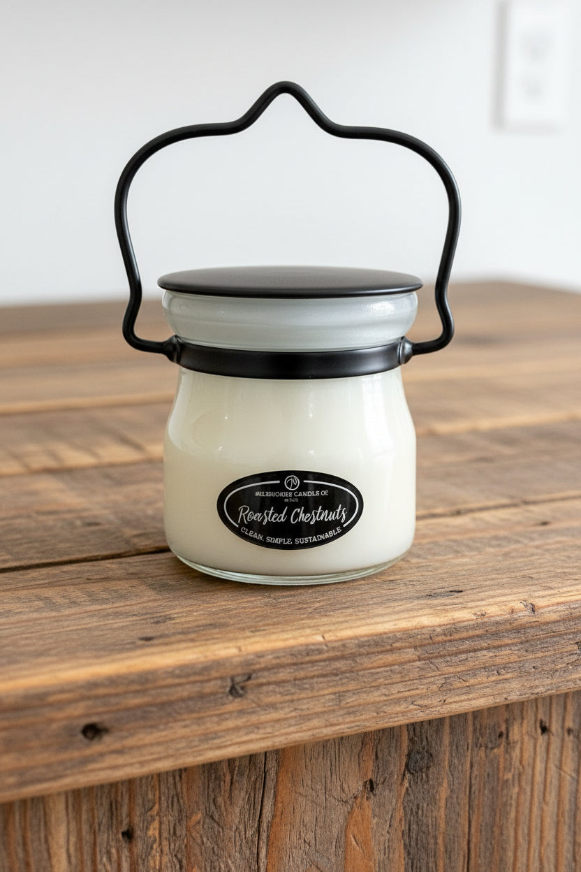 Glass jar with black lid on a white background