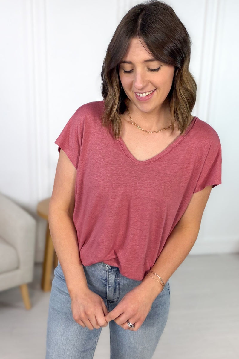 Lightweight berry tee curved hem front tucked into a pair of light wash denim