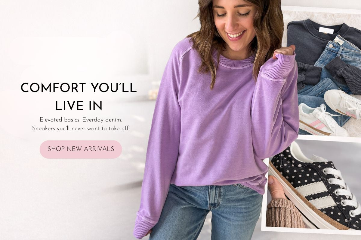 Woman wearing a purple sweatshirt and blue jeans with text about comfort and new arrivals.