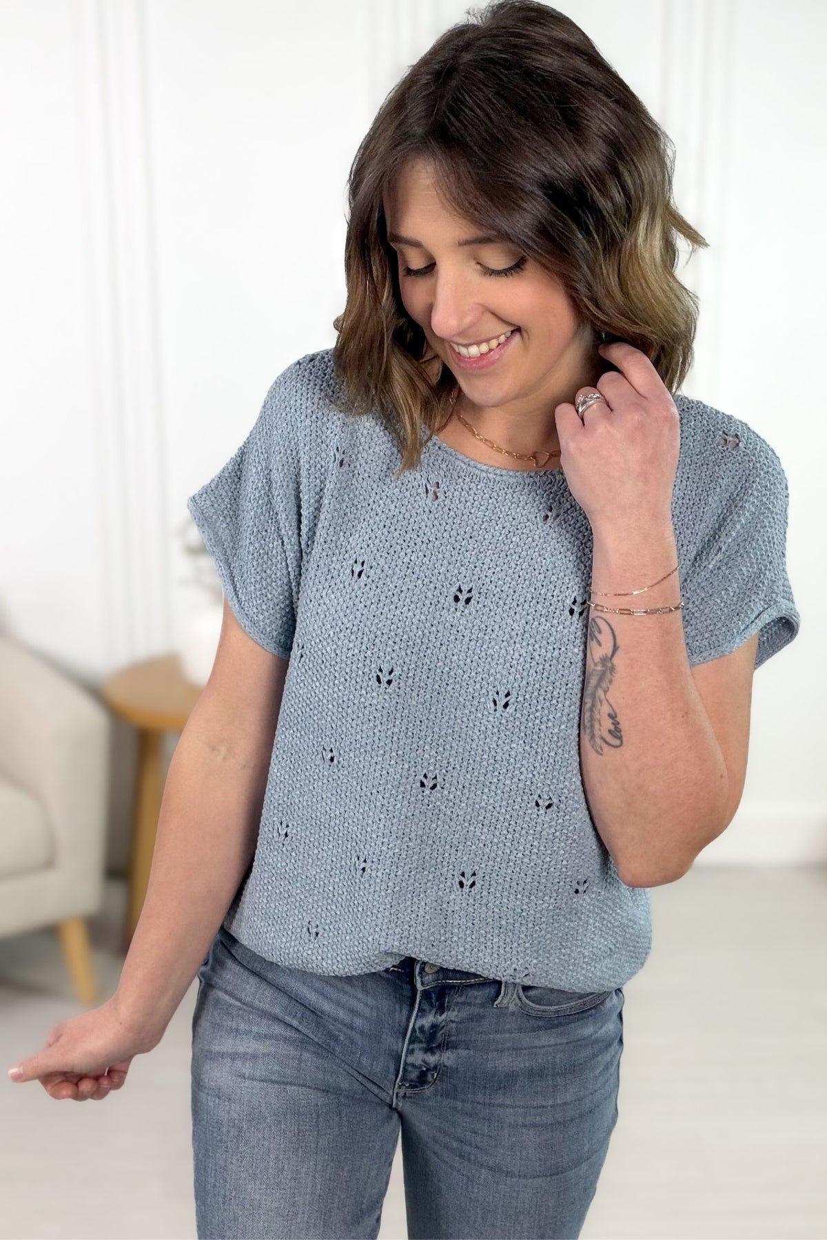 Blue knit short sleeve tee with relaxed fit and textured open knit detail.