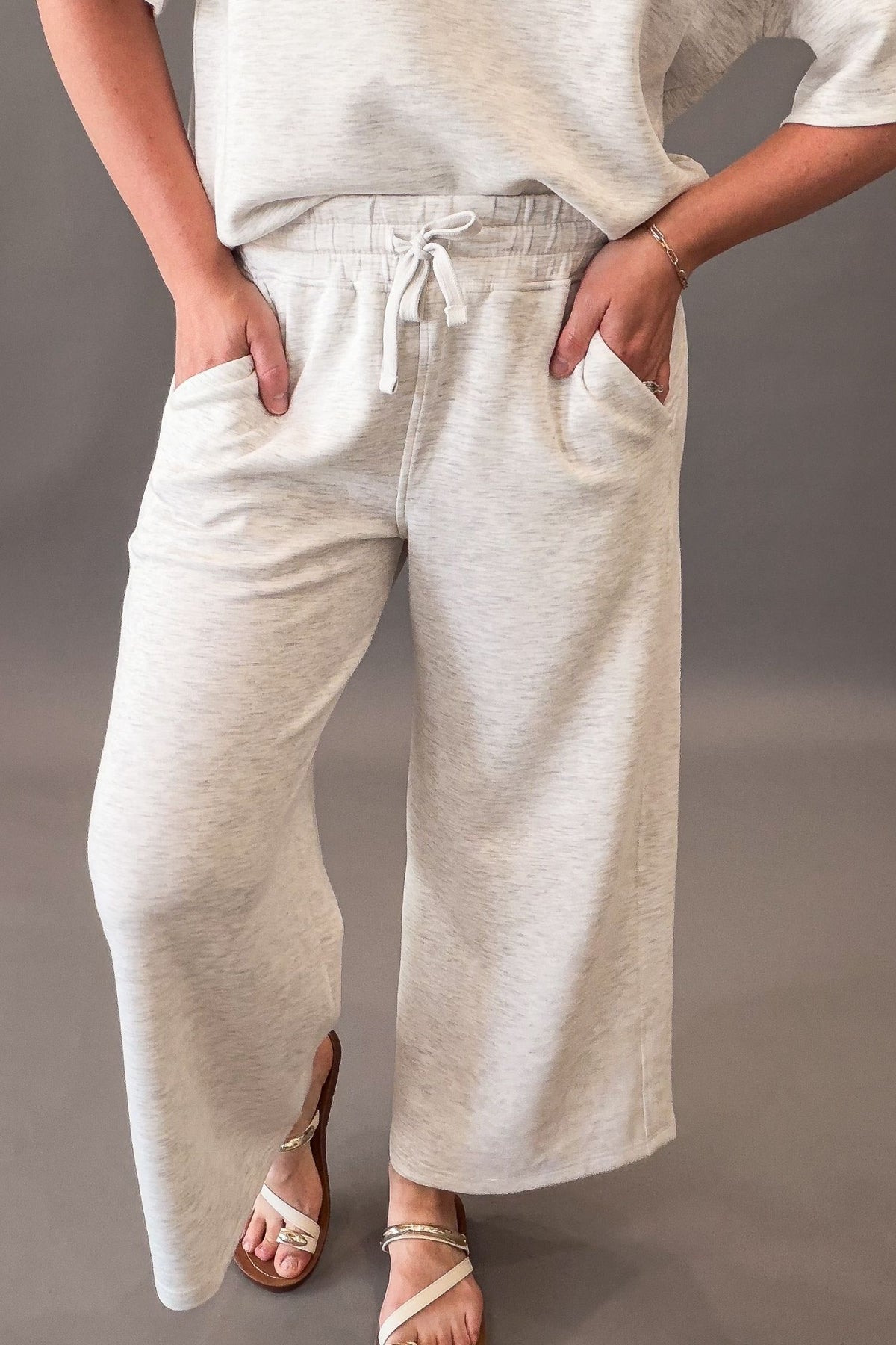 woman wearing heather grey cropped lounge pants