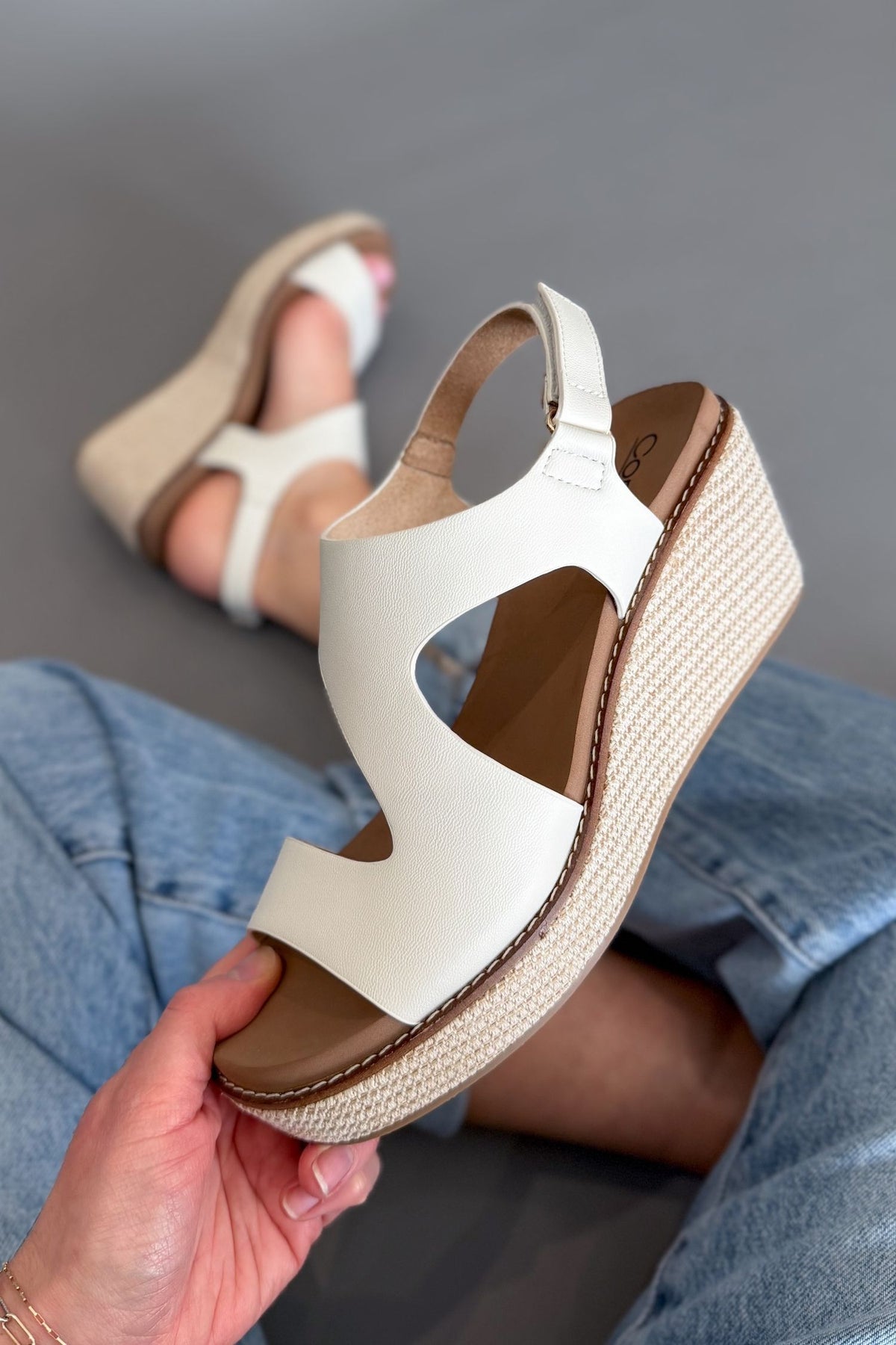 Comfortable white wedge sandals styled with denim