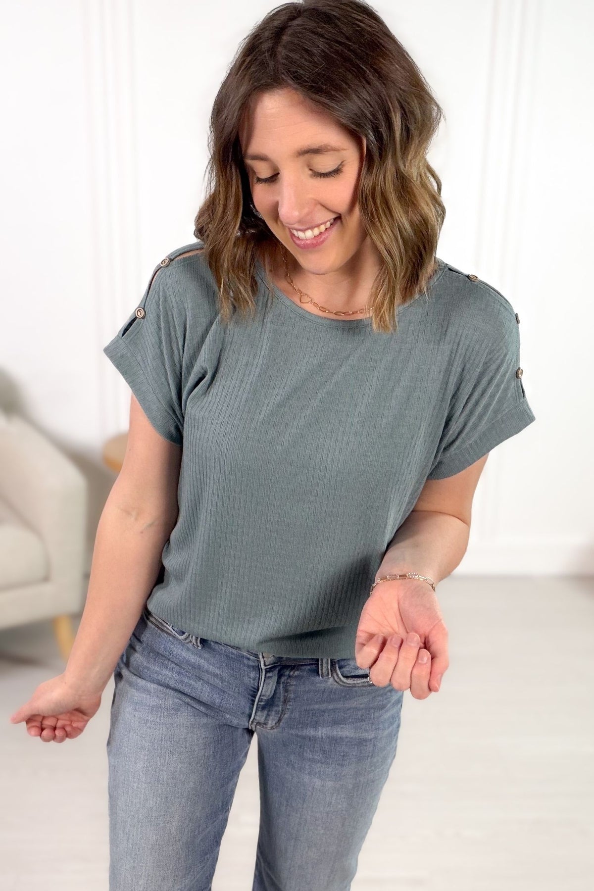 Dusty blue button shoulder detail tee front view styled with denim