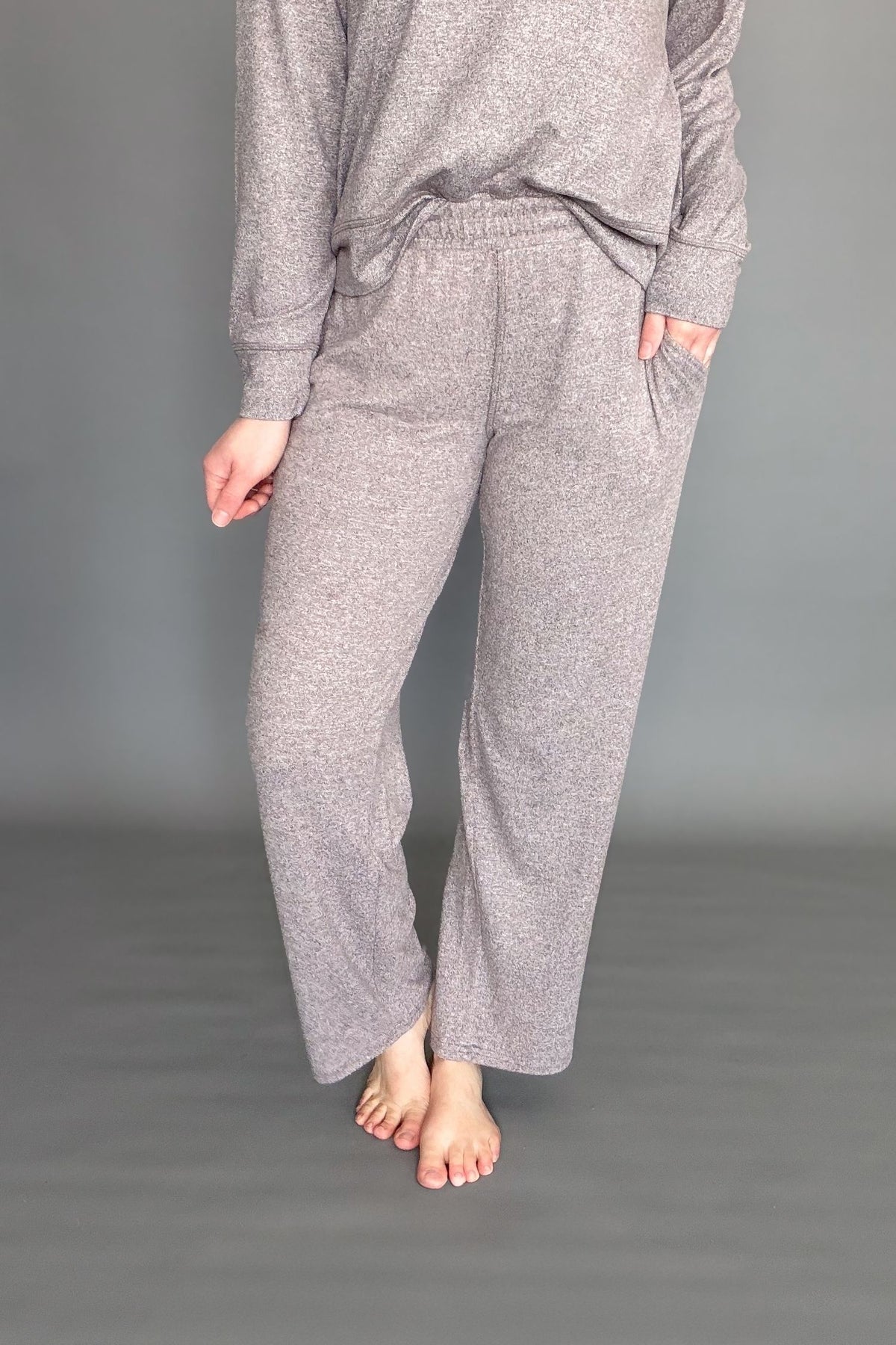 Women's espresso brushed lounge pants worn on a grey background