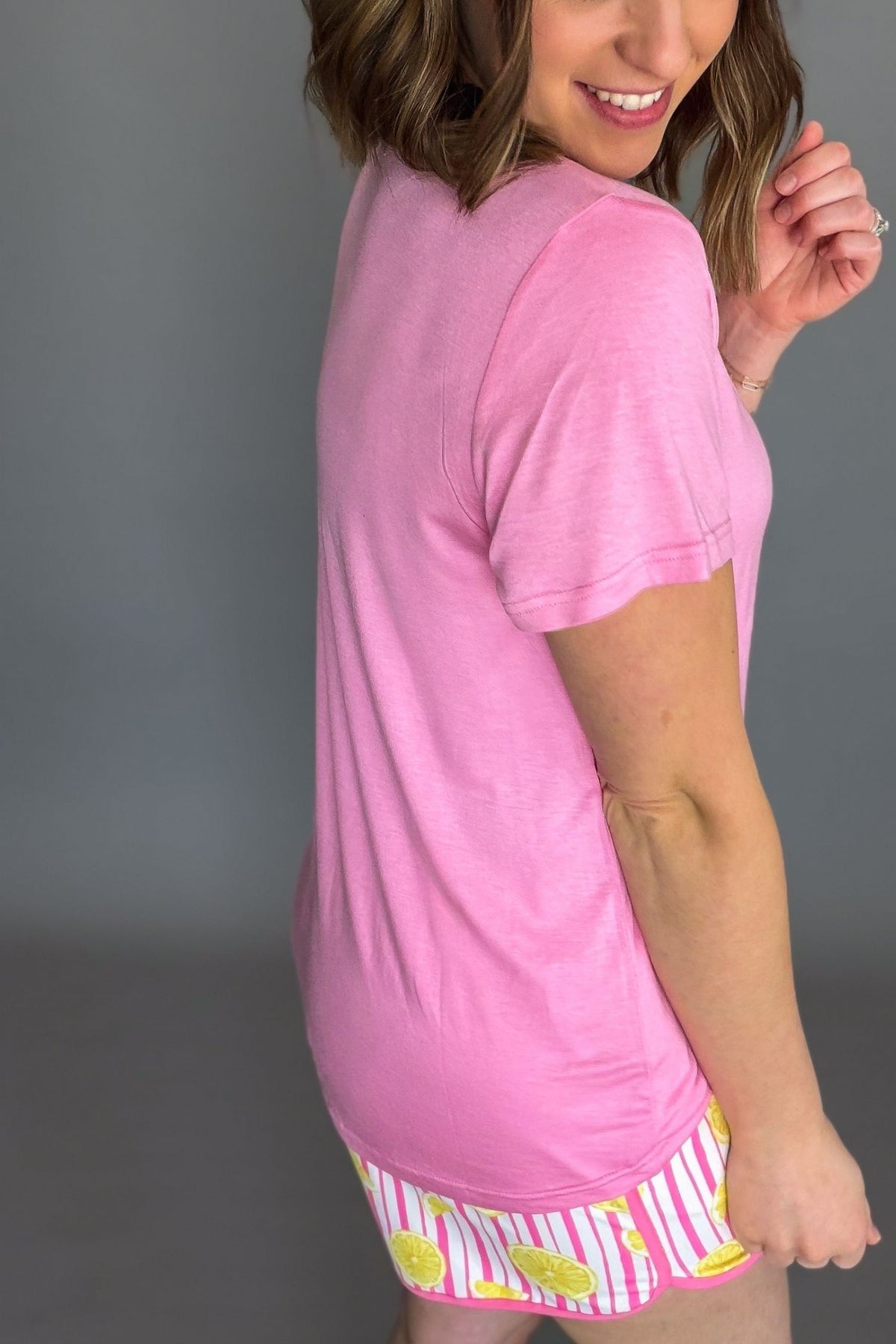 light pink lightweight v-neck tee styled with aqua drawstring shorts showing the side and back details