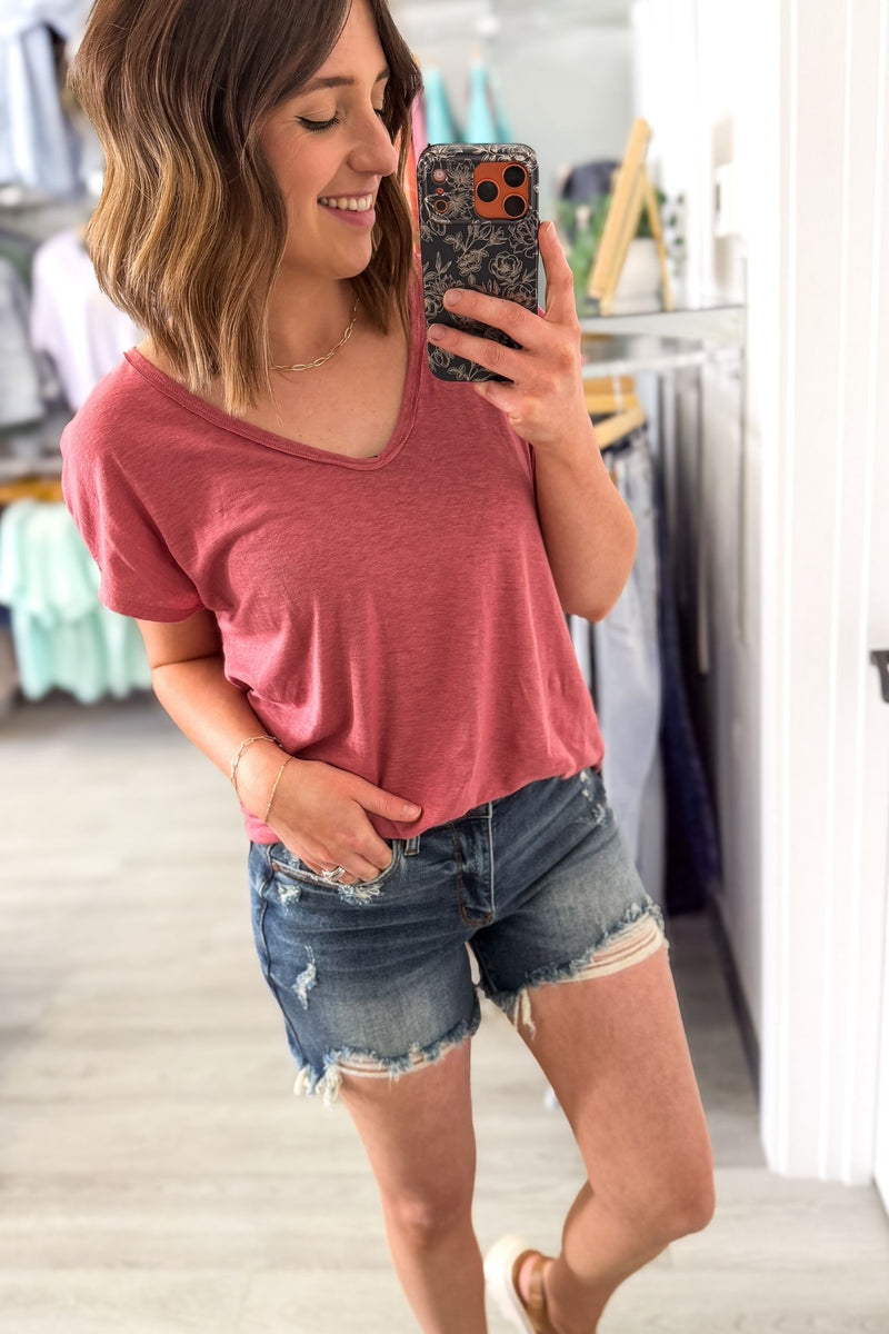 Mid rise Judy Blue denim shorts with distressing and frayed hem