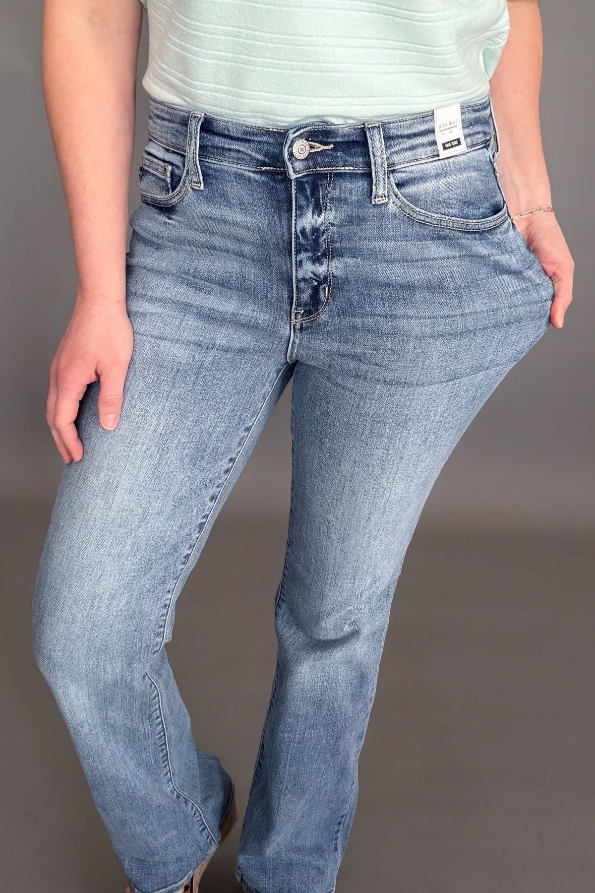 Judy Blue mid rise bootcut jeans with soft stretchy denim and flattering fit showing stretch