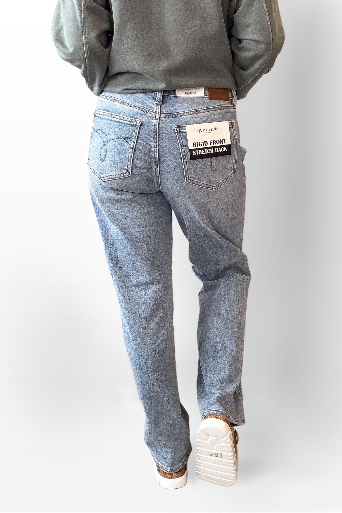 Light blue jeans with a visible brand label on a white background
