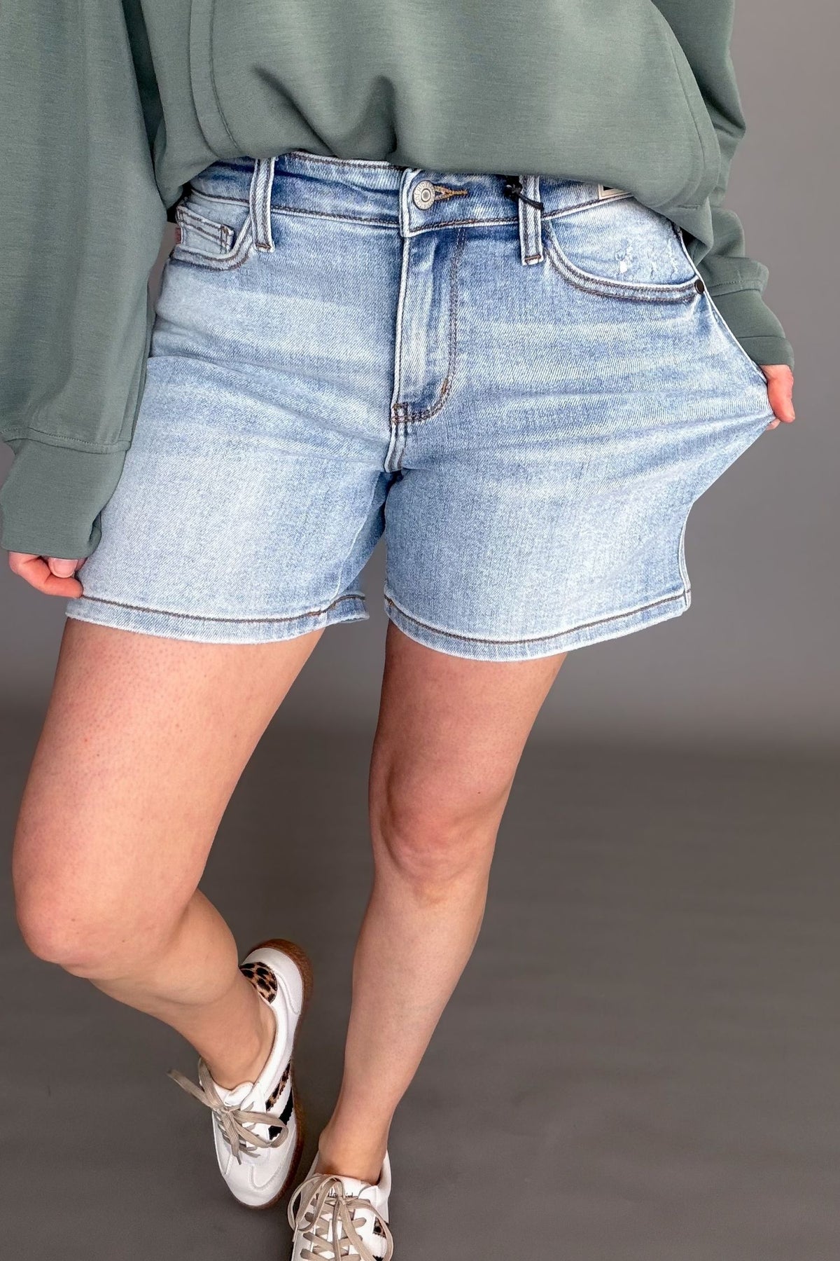 Judy Blue Tamara Mid Rise Vintage Wash Dad Shorts showing stretch