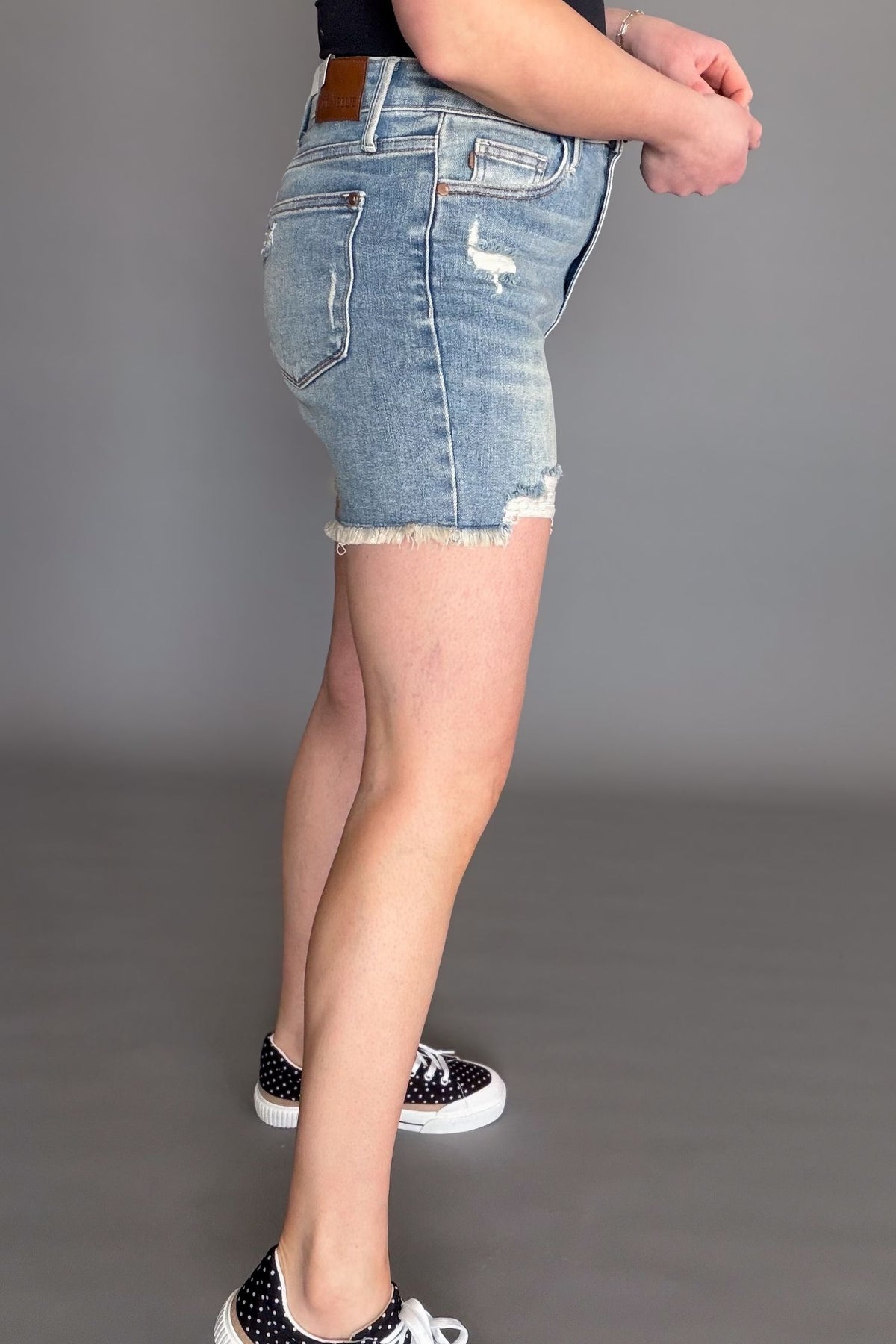 Judy Blue Tinley high waist distressed boutique denim shorts styled casually showing side fit