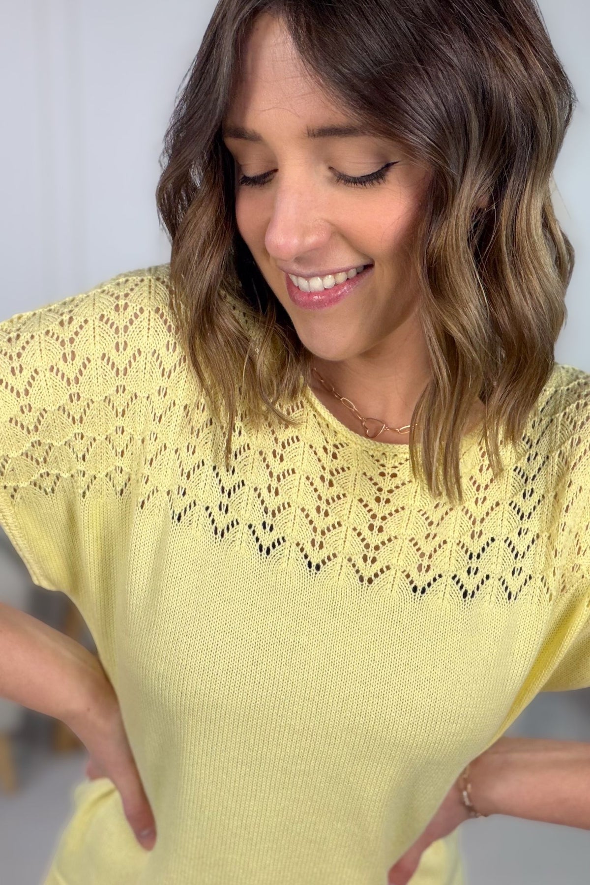 Soft spring sweater in lemon yellow color close up