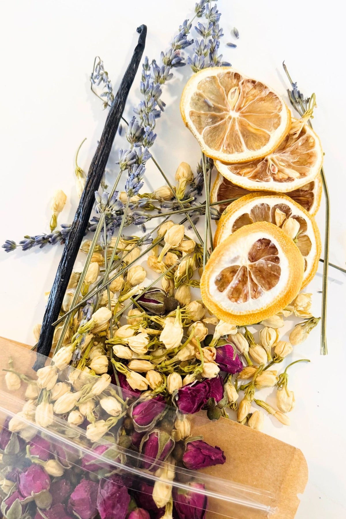 Simmer pot potpourri with rose buds, lemon and other natural ingredients