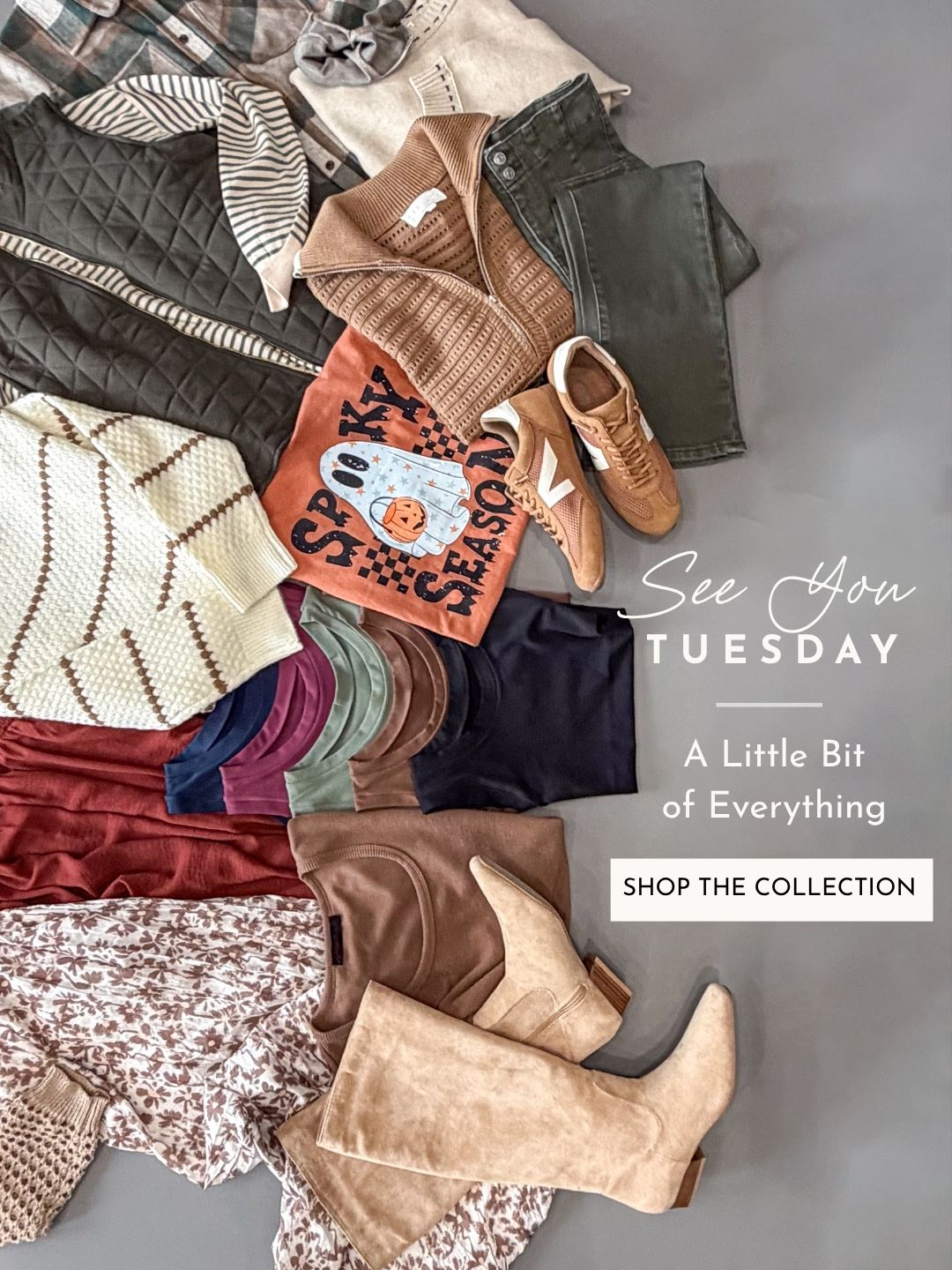 A styled flat-lay of multiple clothing items and accessories arranged on a gray surface, including a quilted vest, striped knit top, dark green pants, tan boots, a patterned orange cardigan, folded sweaters, and other apparel. White text on the right reads 'See You TUESDAY', 'A Little Bit of Everything', and 'SHOP THE COLLECTION'.