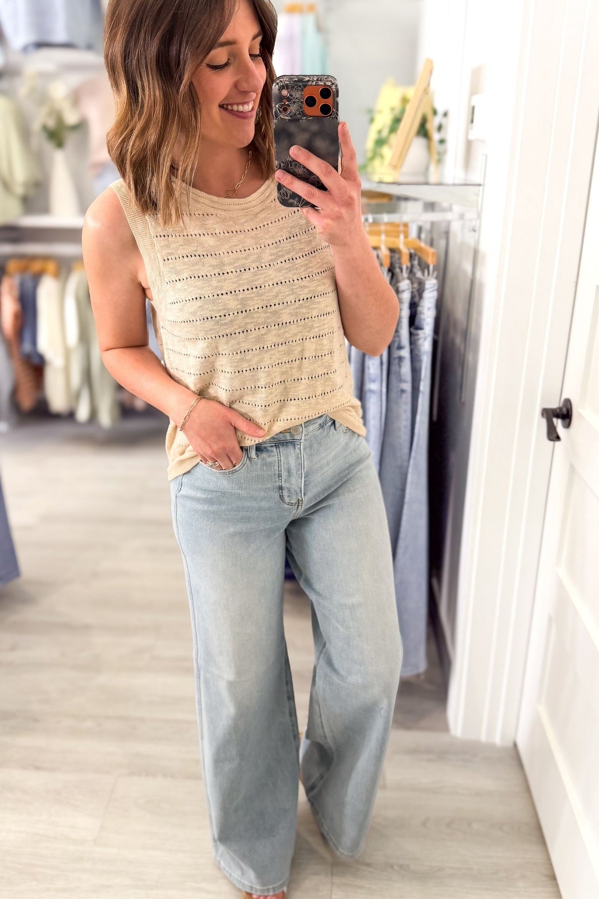 Woman wearing a natural pointelle knit tank top with light wash denim, lightweight sleeveless textured top for women