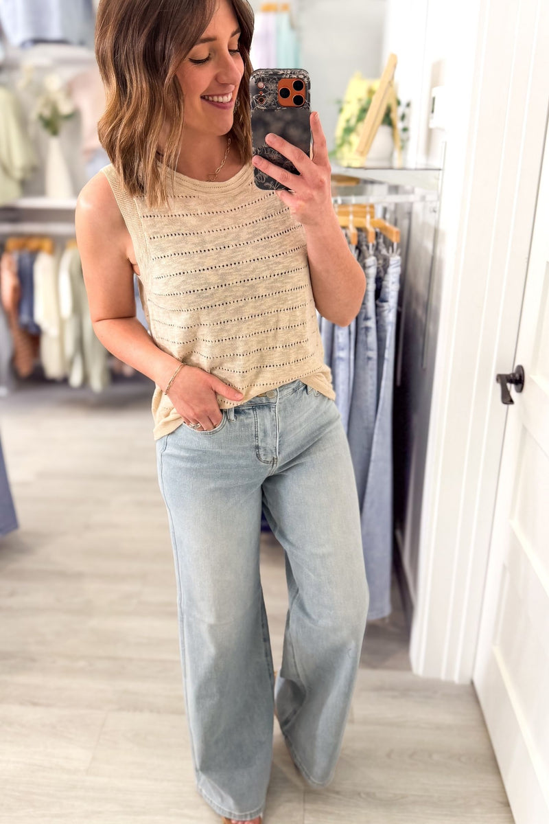 Woman wearing a natural pointelle knit tank top with light wash denim, lightweight sleeveless textured top for women