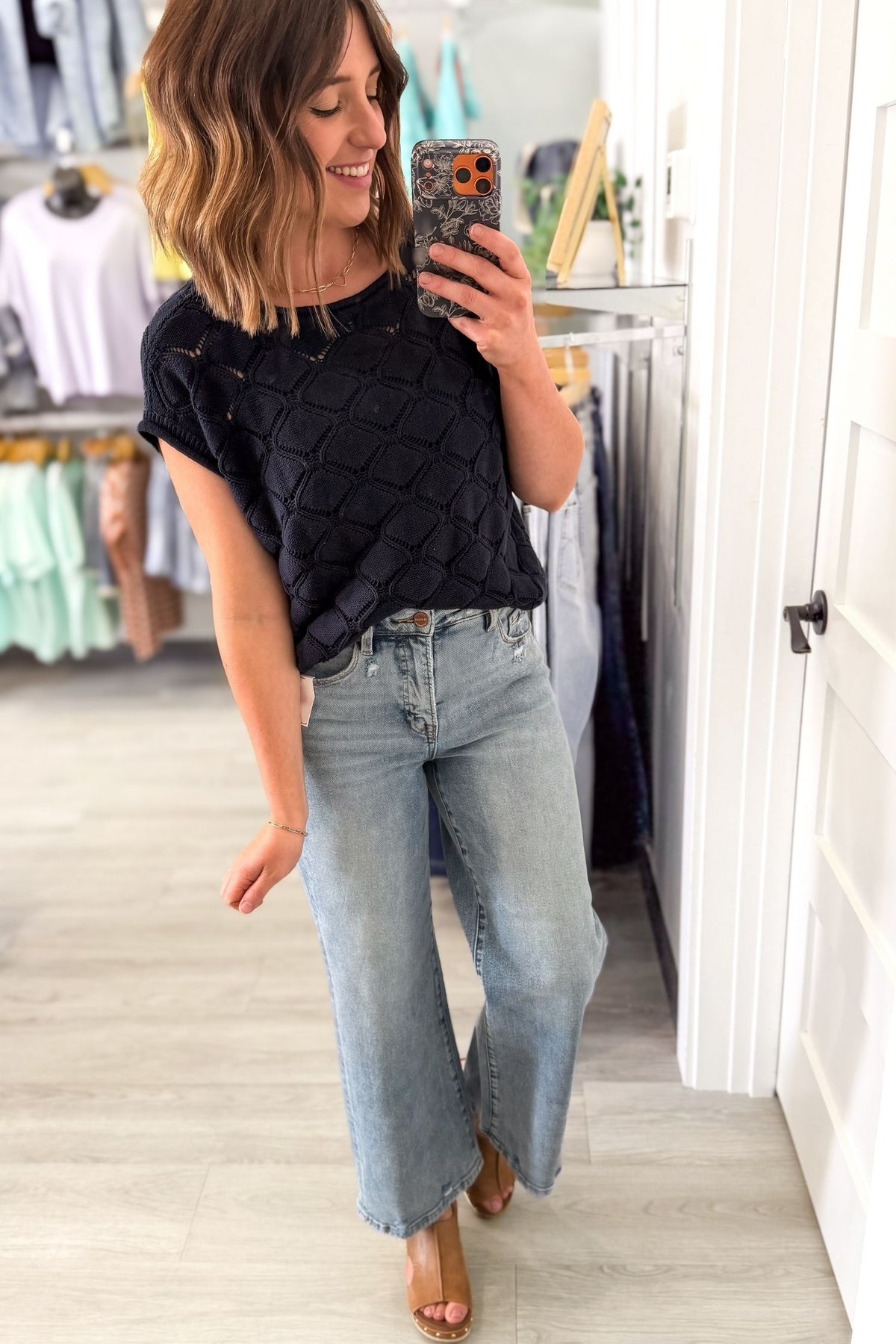 classic navy cable knit top outfit inspiration selfie. Styled with denim and a wedge
