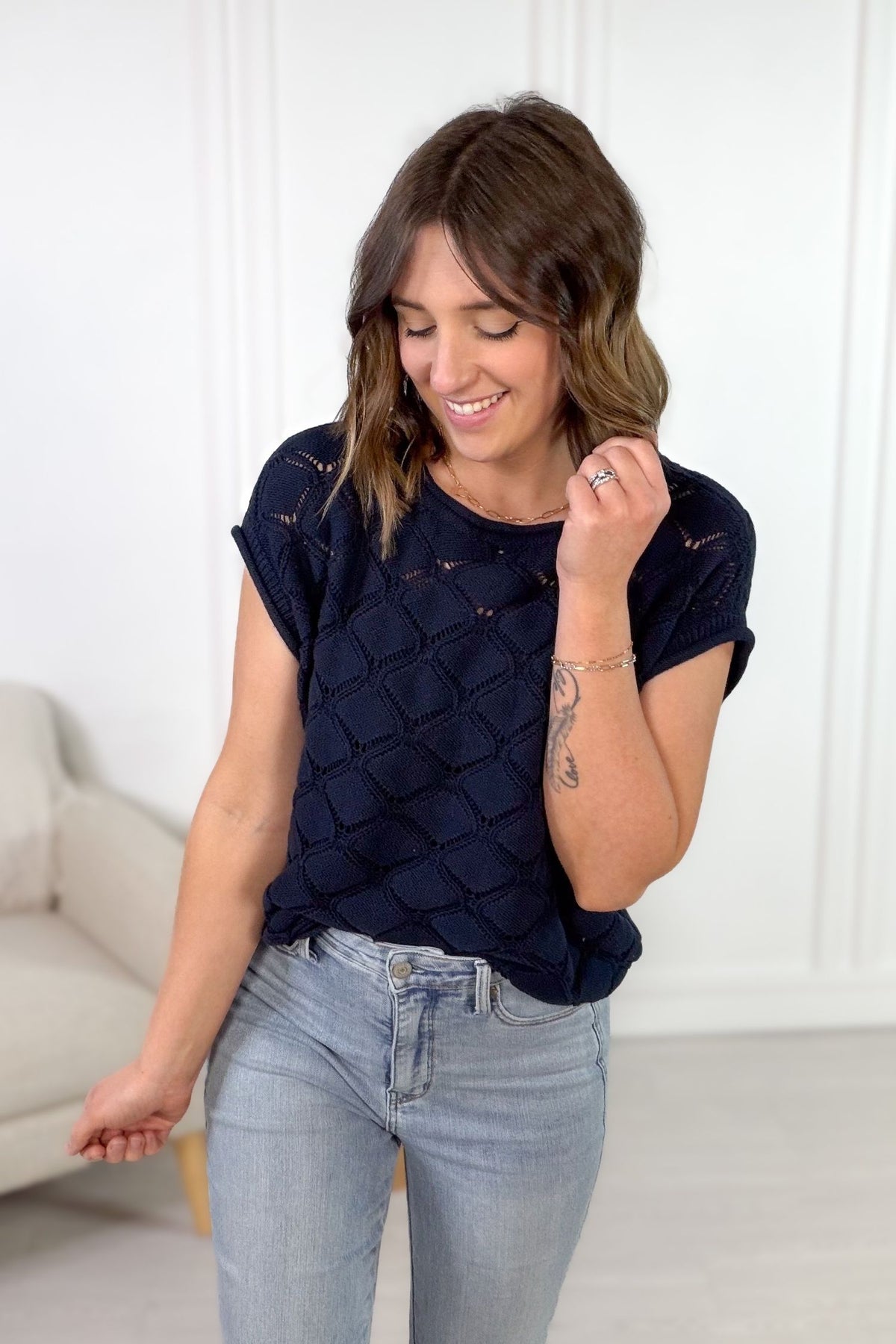 lightweight navy sweater with slightly rolled sleeves