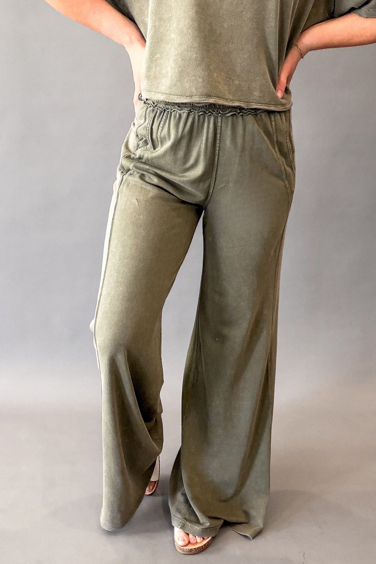 Woman wearing olive green butter terry wide leg pants