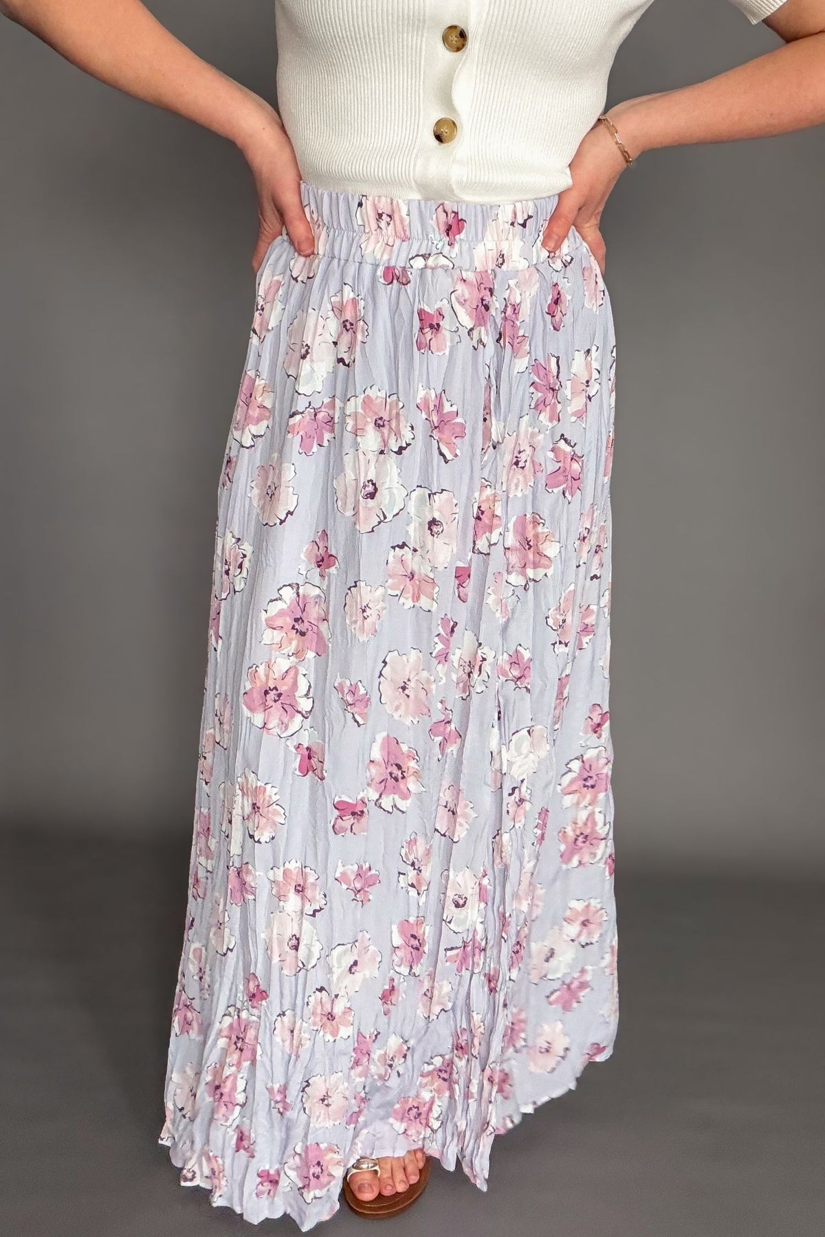 Orchid floral maxi skirt with elastic waistband and soft floral print styled with ivory cardigan
