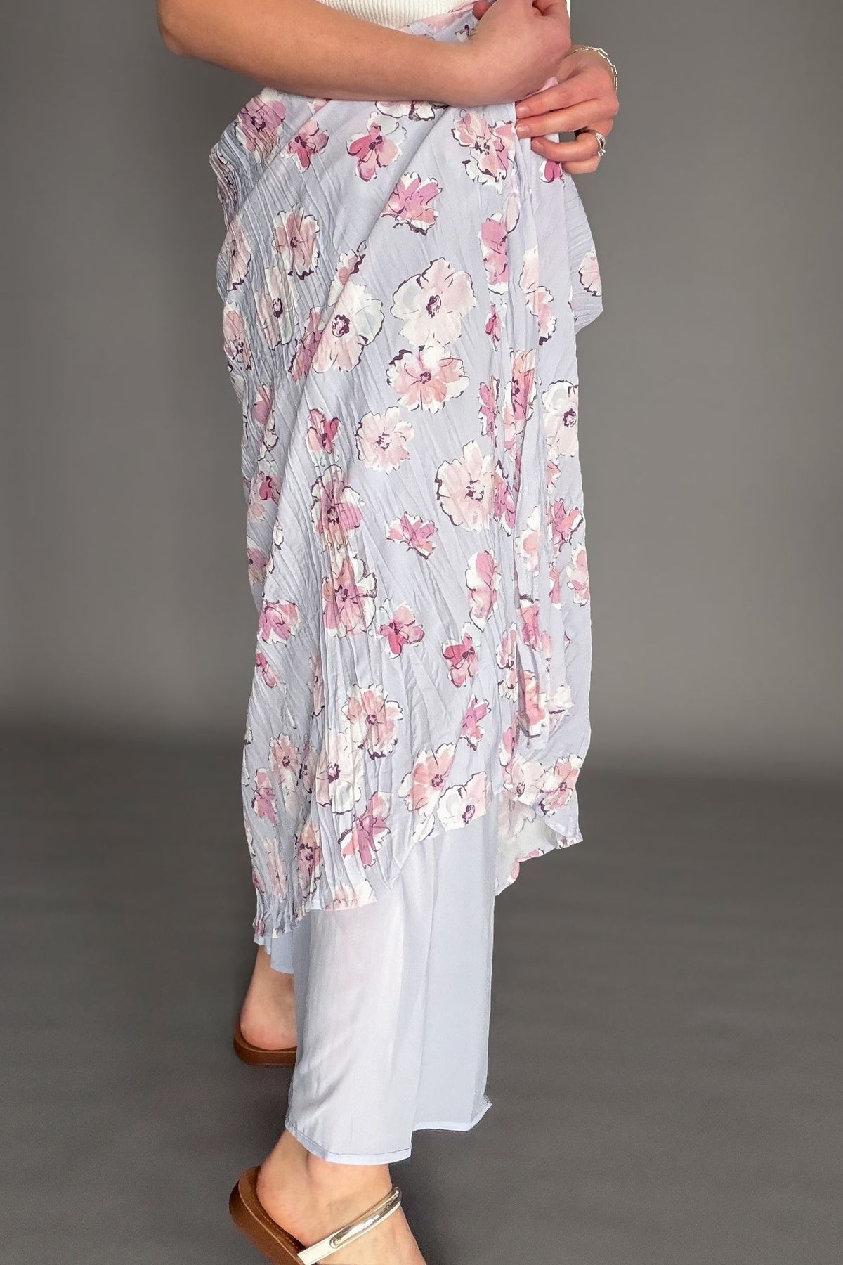 Orchid floral maxi skirt with elastic waistband and soft floral print styled with ivory cardigan showing the lining.