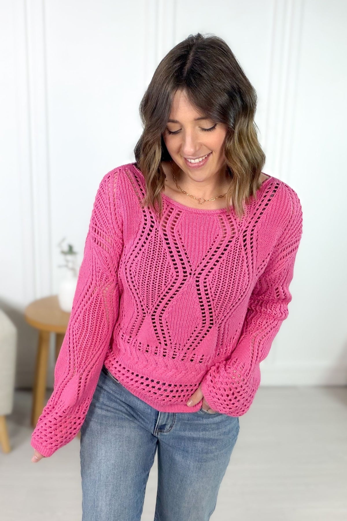 Bright pink sweater with crochet texture