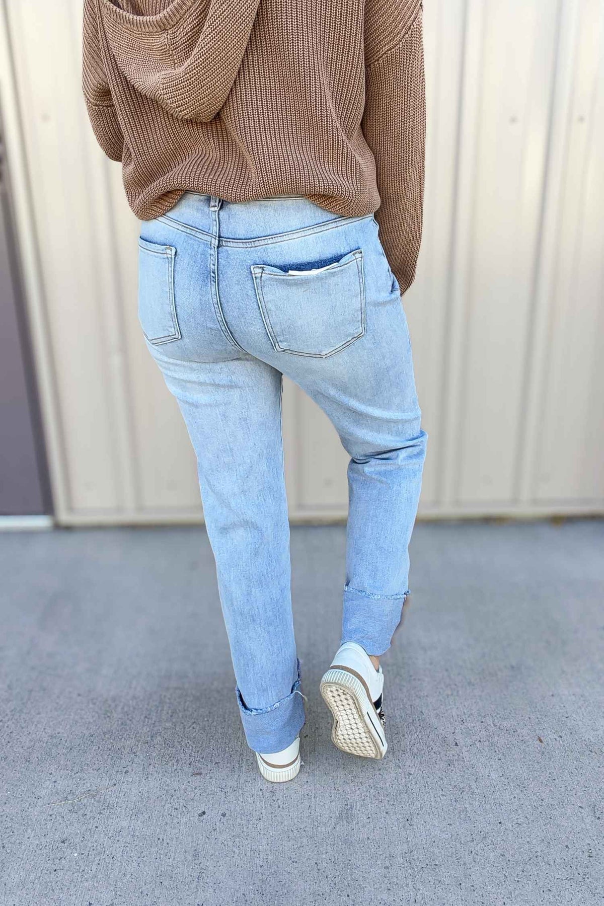Light blue jeans worn by a person with a neutral background