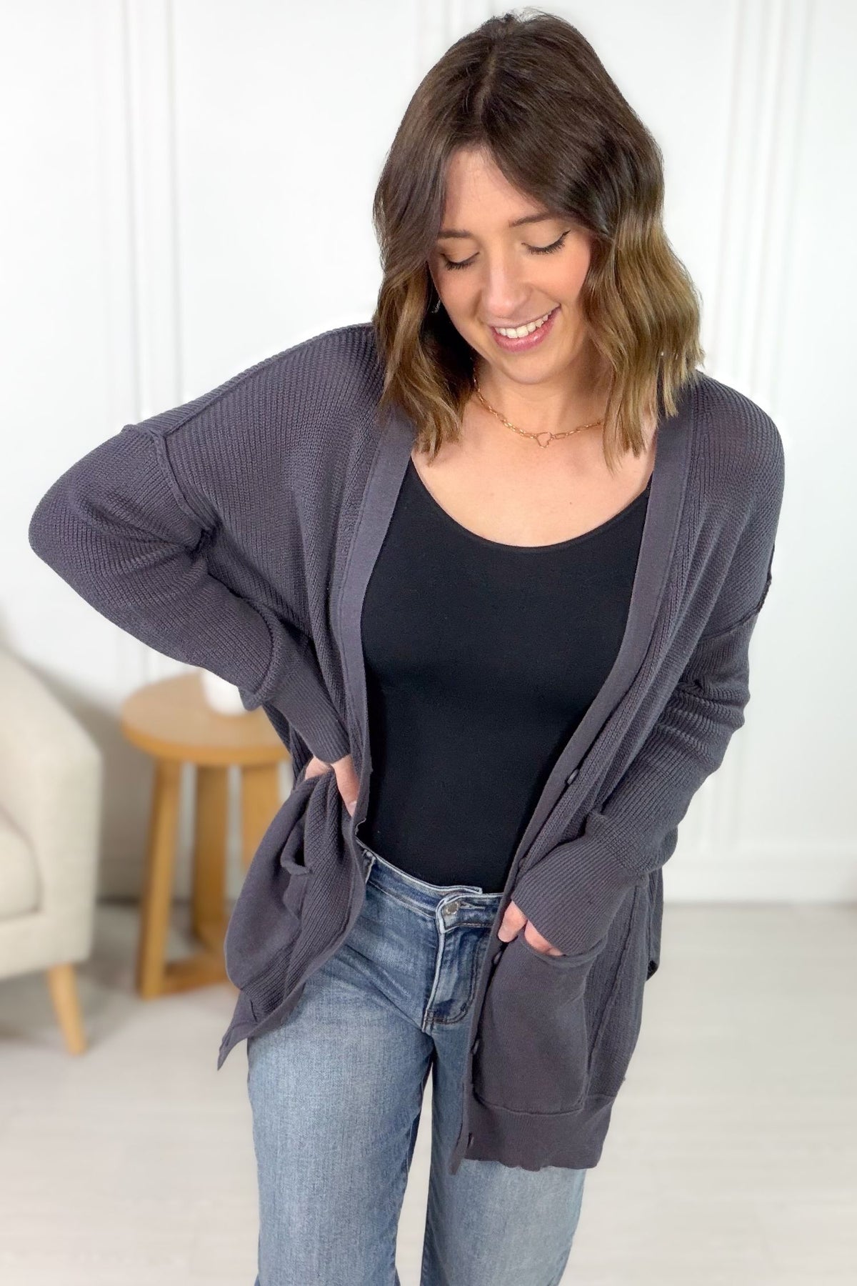 Relaxed fit button cardigan with front pockets and side slits