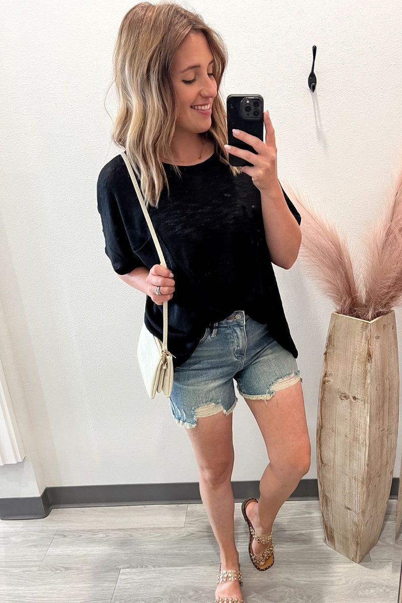 Black casual slub tee styled with crossbody, shorts and sandals