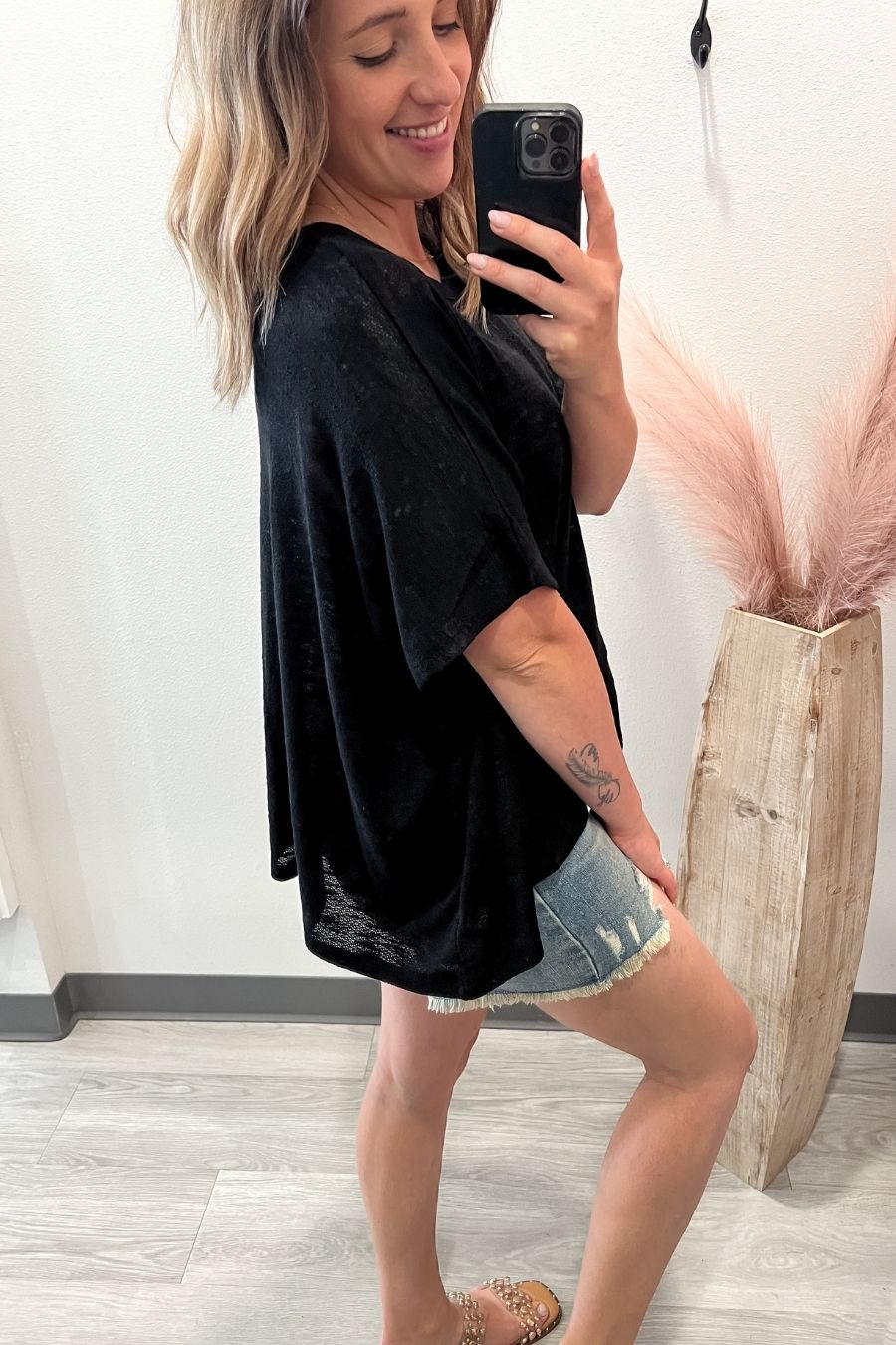 Side view of a relaxed fit slub knit tee