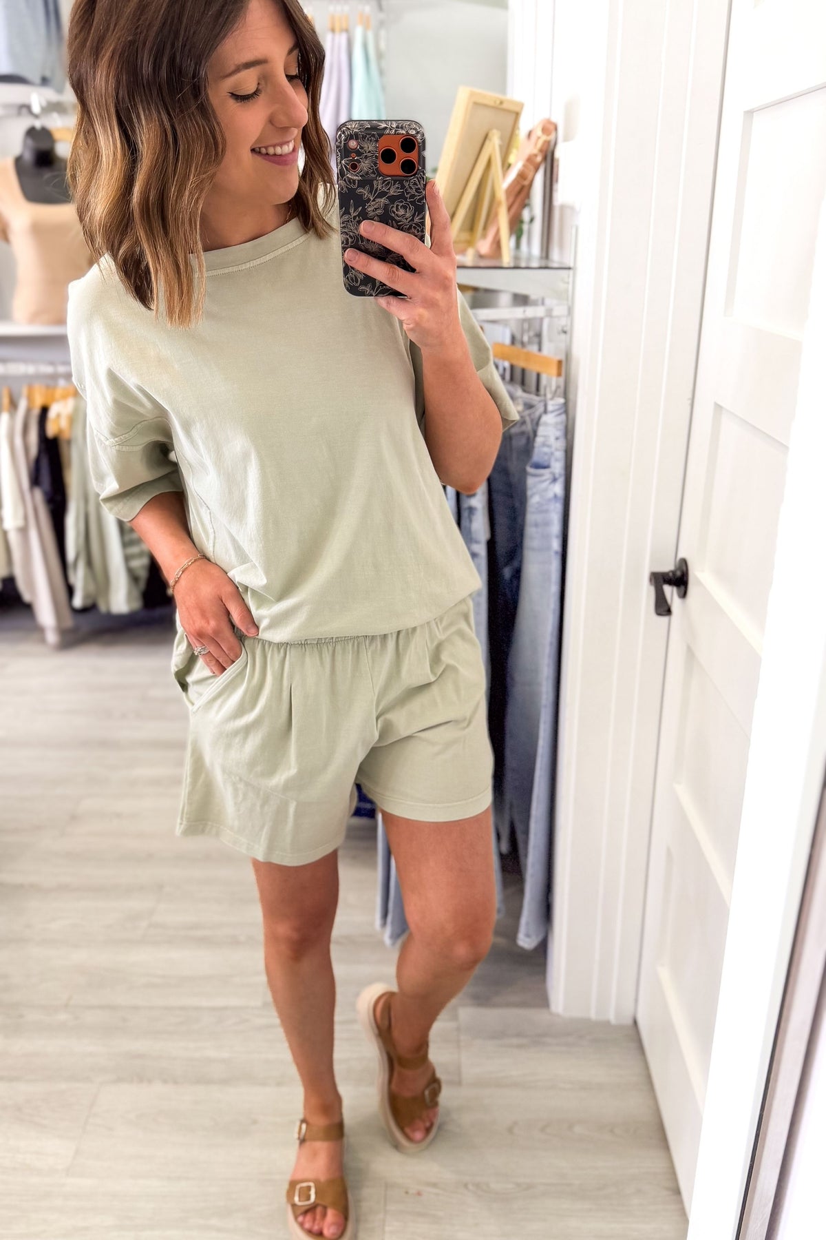 woman taking a mirror selfie wearing an everyday mint cotton shorts set