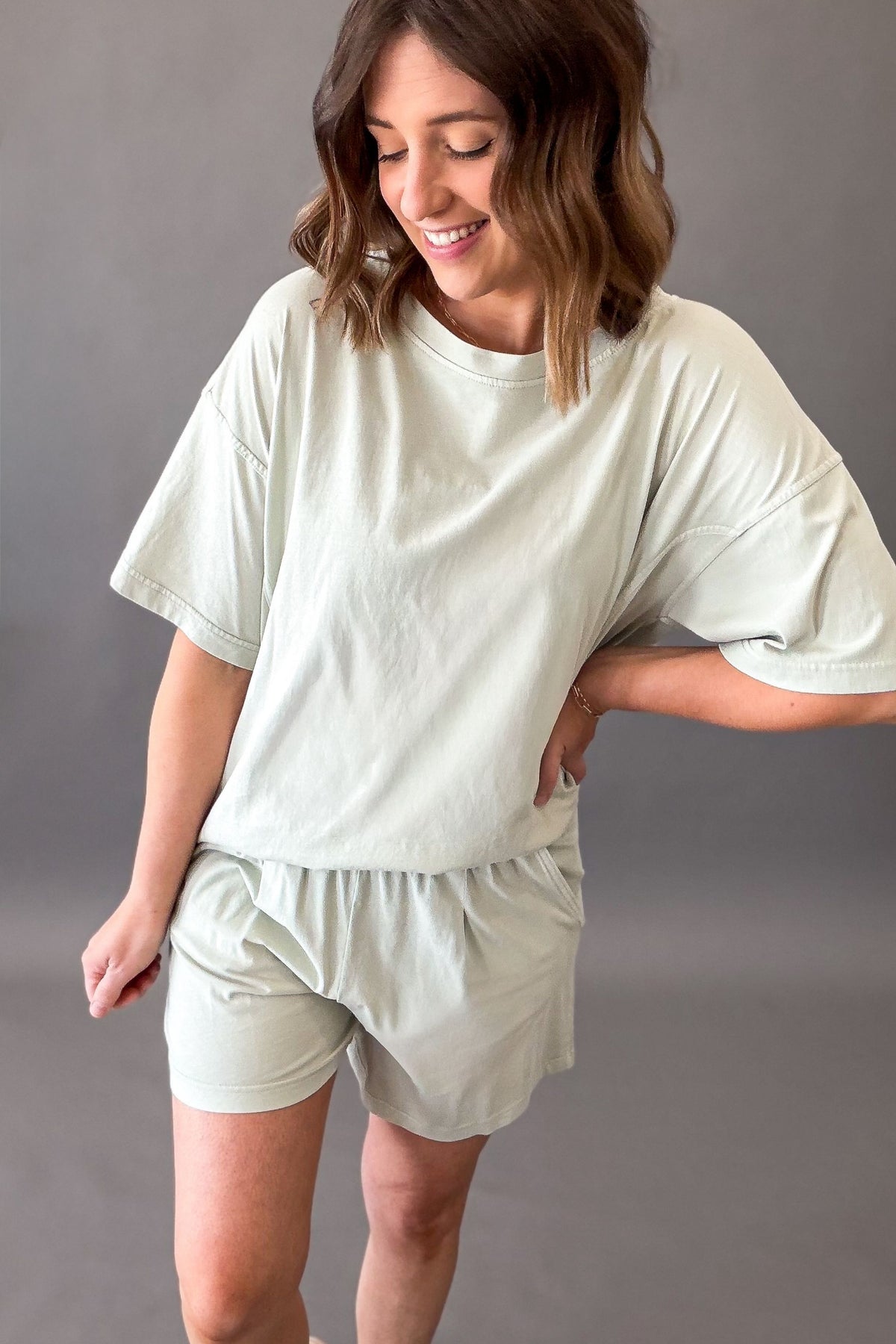 woman wearing a casual mint green lounge short sleeve and shorts