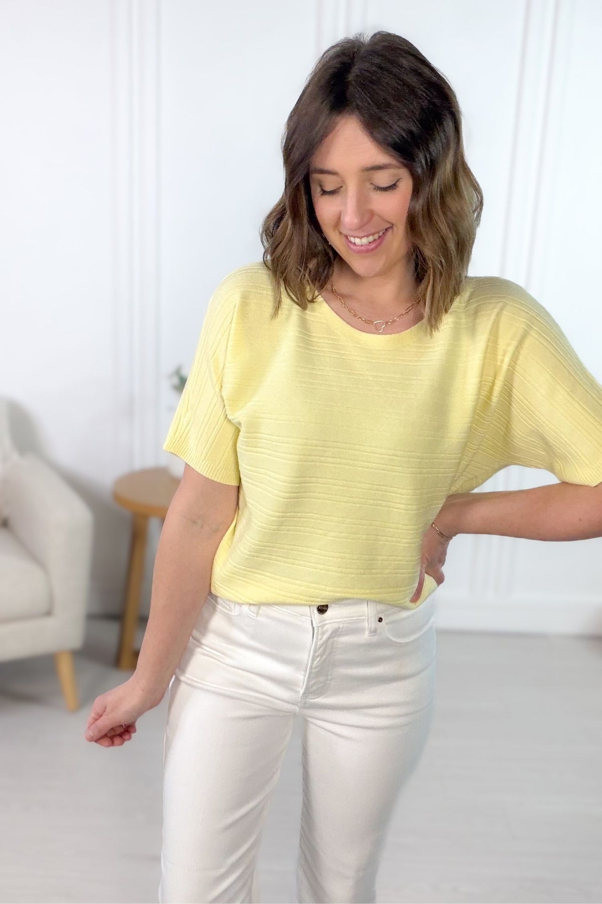 Soft yellow ribbed short sleeve tee styled with white denim jeans