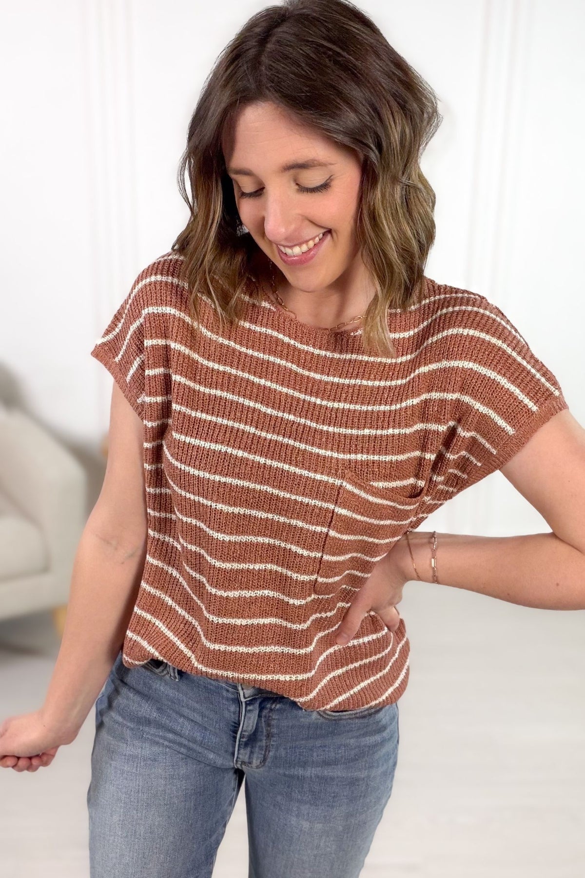 Terracotta striped knit short sleeve top styled with denim jeans