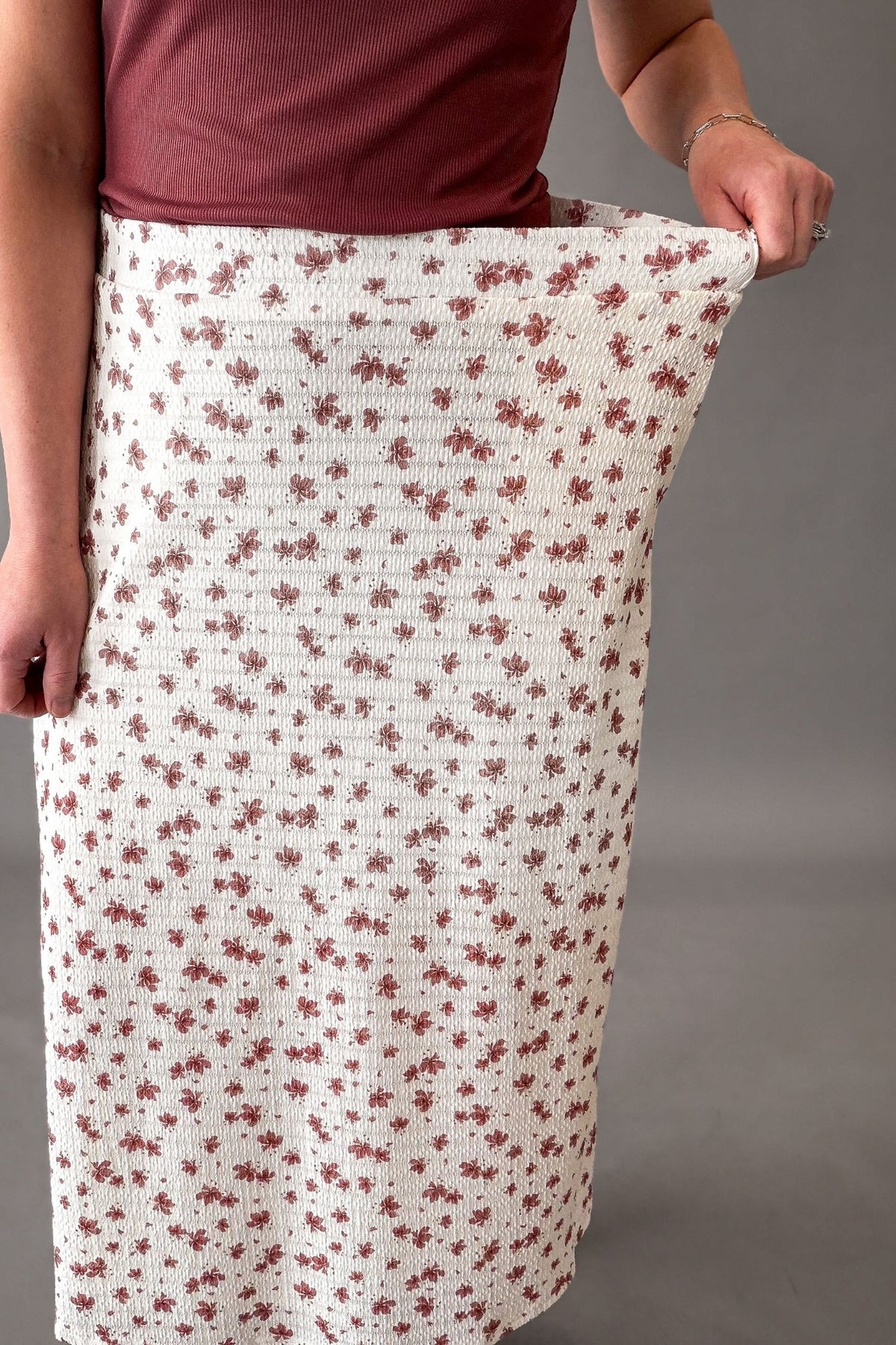 woman wearing a textured skirt showing stretch in the waistband