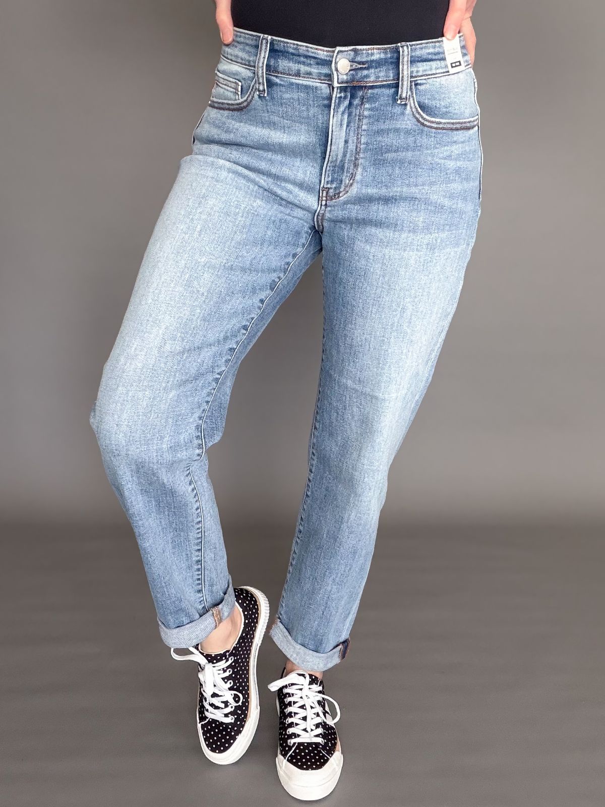 woman wearing a medium wash pair of Judy Blue Boyfriend denim jeans