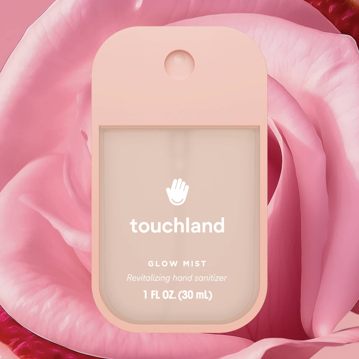 Touchland hand sanitizer packaging on a pink rose background