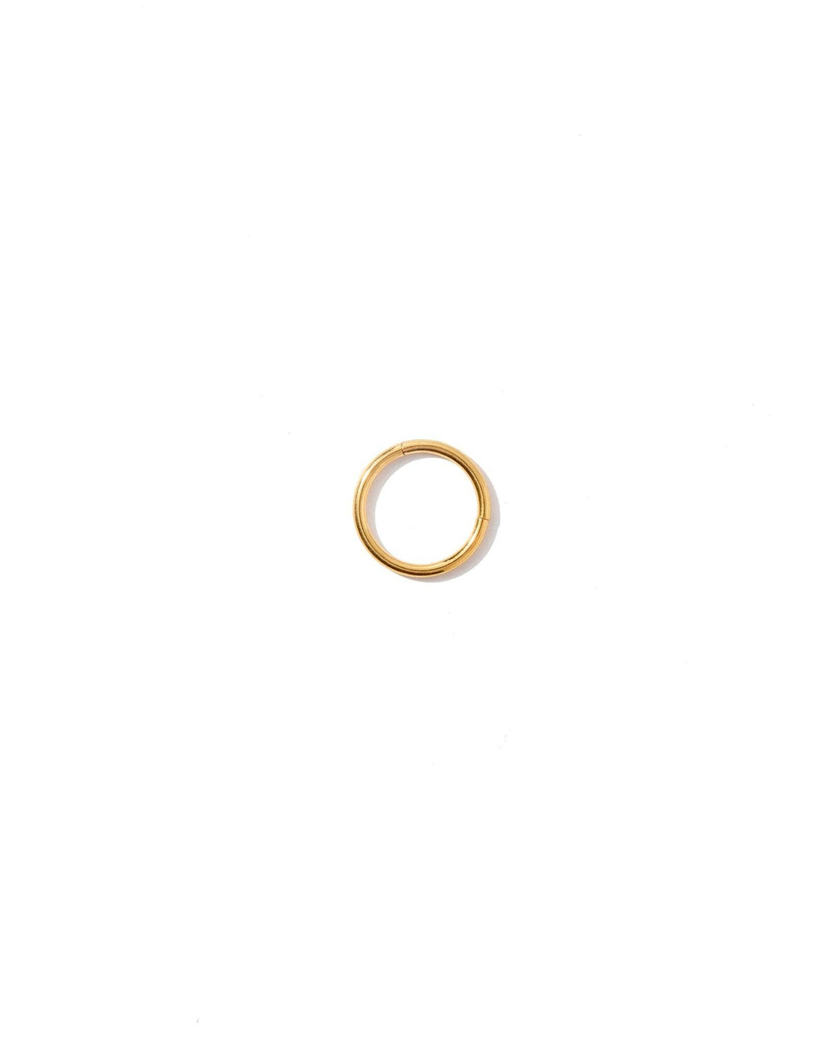 Gold earring on a white background