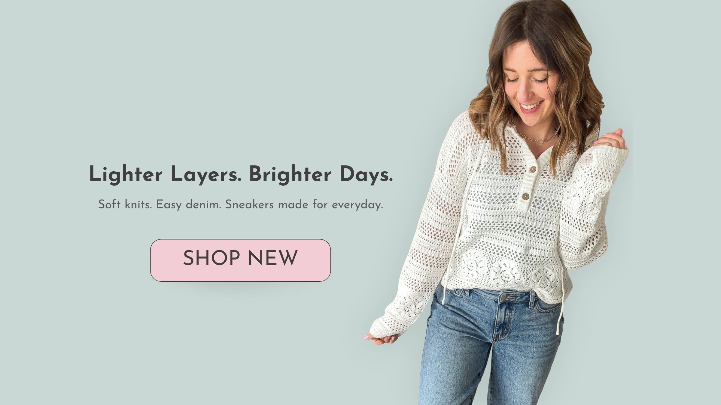 Woman wearing a white knit top and blue jeans with promotional text on a light green background with a shop new button